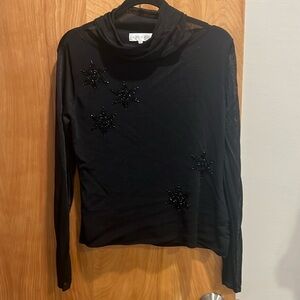 Black holiday sweater with black beads.